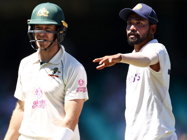 Australian captain Tim Paine (left) speaks with Indian fast bowler Mohammed Siraj. Picture: Getty Images