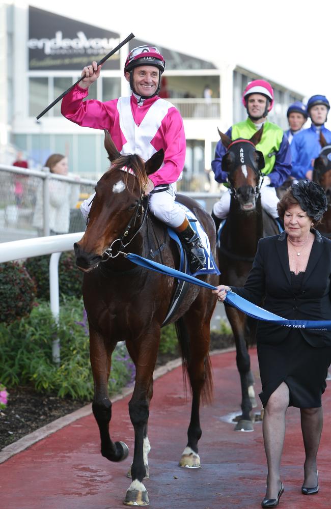 Delicacy and jockey Peter Hall are led in by owner Sandra Peters.