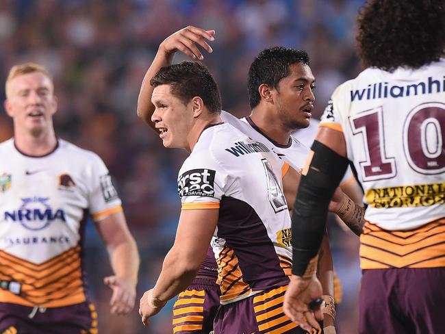 James Roberts celebrates scoring a try against the Titans.