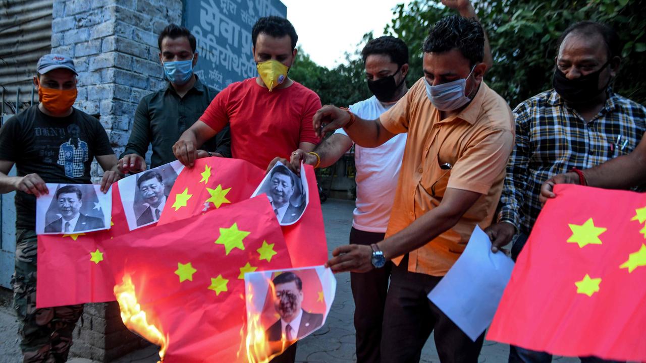 Activists burn the Chinese flags during an anti-China protest in Amritsar. Picture: Narinder Nanu/AFP