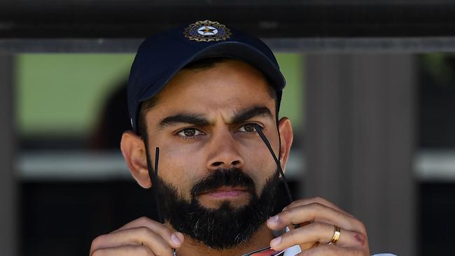 India's captain Virat Kohli (C) sits on the players bench at the end of second Test cricket match between Australia and India in Perth on December 18, 2018. (Photo by WILLIAM WEST / AFP) / -- IMAGE RESTRICTED TO EDITORIAL USE - STRICTLY NO COMMERCIAL USE --<a capiid="6a2d86a1143cba1813c7d2e118d2a715" class="capi-video">India reach boiling point</a>                     