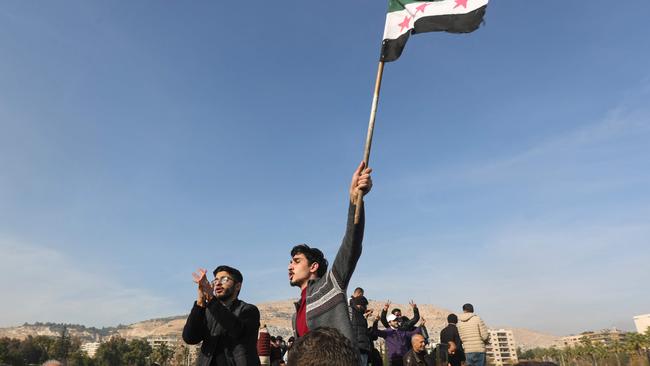 People in Damascus celebrate after Bashir al-Assad flees. Picture: AFP.