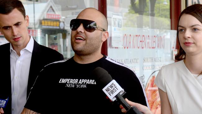 Bradley Daniele (centre) is seen walking on Gouger Street after leaving Adelaide Magistrates Court in 2019 after being charged with assaulting a sex offender in prison. Picture: AAP Image