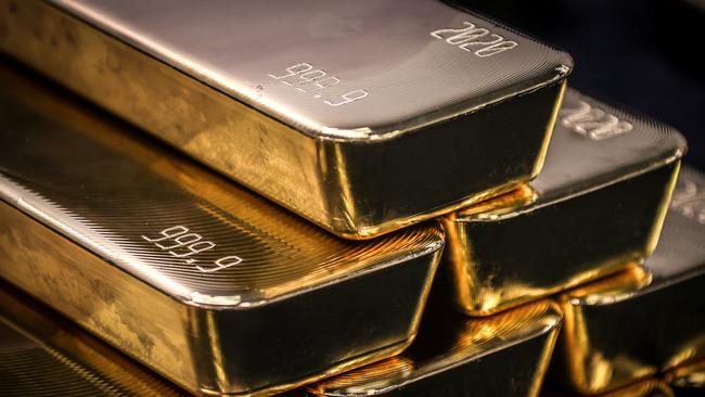 TOPSHOT - Gold bullion bars are pictured after being inspected and polished at the ABC Refinery in Sydney on August 5, 2020. - Gold prices hit 2,000 USD an ounce on markets for the first time on August 4, the latest surge in a commodity seen as a refuge amid economic uncertainty. (Photo by DAVID GRAY / AFP)