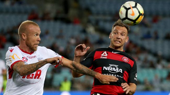 Brendon Santalab (right) tussles with Adelaide's Taylor Regan. Picture: Toby Zerna