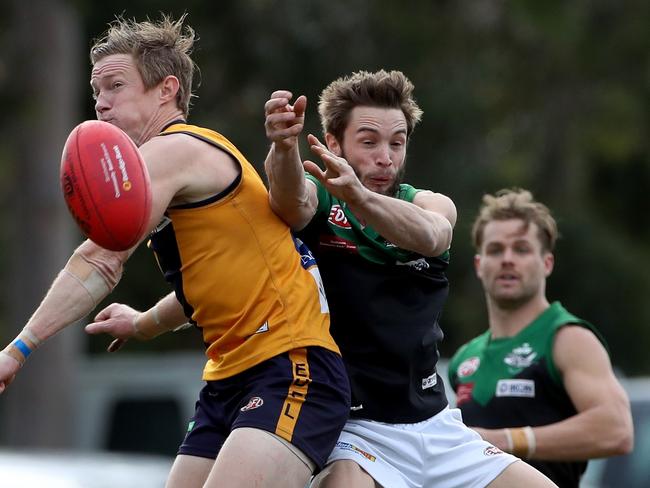 Luke Jarrad of Strathmore spoils Nick Maric of Greenvale. Picture: Mark Dadswell