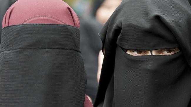 A Muslim woman defying the rule was spotted being told to remove her veil in the town of Zell am See. Picture: AP.