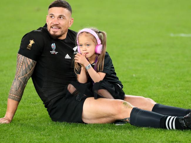 Sonny Bill Williams of New Zealand sits on the pitch with his daughter after making his last appearance for New Zealand in the Rugby World Cup. Picture: Getty