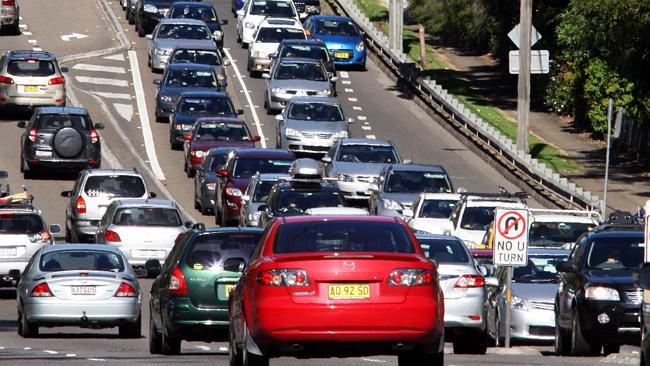  A long line of cars caught in a traffic jam along the Pacific Highway at Wahroonga waiting to get onto the F3 motoway. 