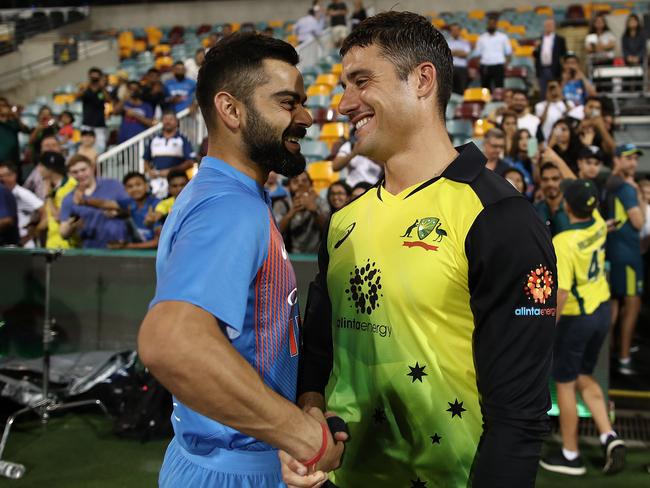 Good mates Virat Kohli and Marcus Stoinis chat after game one of the International Twenty20 series between Australia and India at The Gabba. Picture: Getty Images