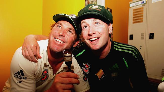 Shane Warne (L) and Michael Clarke pose with a replica Ashes Urn in the changing rooms after day five of the third Ashes Test Match between Australia and England at the WACA in 2006.