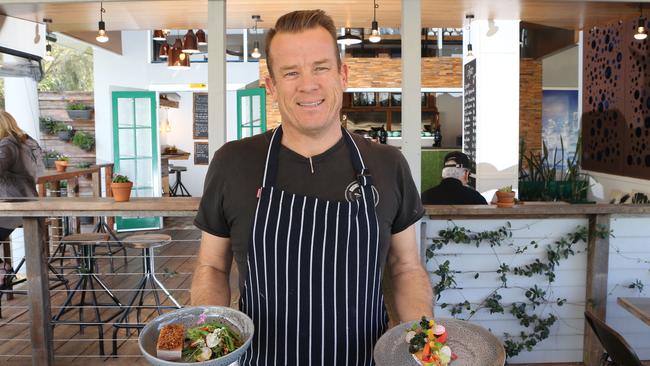 Allotment Cafe at Reedy Creek. Simon Capewell with food and a selection from the menu. Picture Glenn Hampson