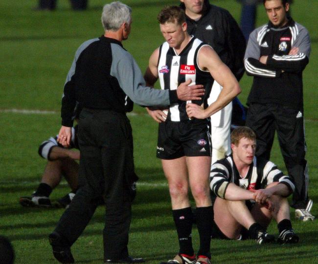 Mick Malthouse and Nathan Buckley after the 2002 Grand Final.