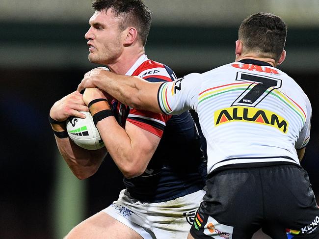 Angus Crichton of the Roosters is tackled by Nathan Cleary of the Panthers during the Round 24 NRL match between the Sydney Roosters and the Penrith Panthers at the SCG in Sydney, Saturday, August 31, 2019. (AAP Image/Dan Himbrechts) NO ARCHIVING, EDITORIAL USE ONLY