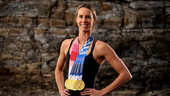 Emma McKeon poses with her record four gold medals from Tokyo Olympics.