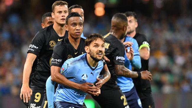 The Wanderers’ Keanu Baccus wraps up Sydney FC striker Milos Ninkovic during the corresponding Sydney derby at Sydney Cricket Ground last year. Picture: AAP