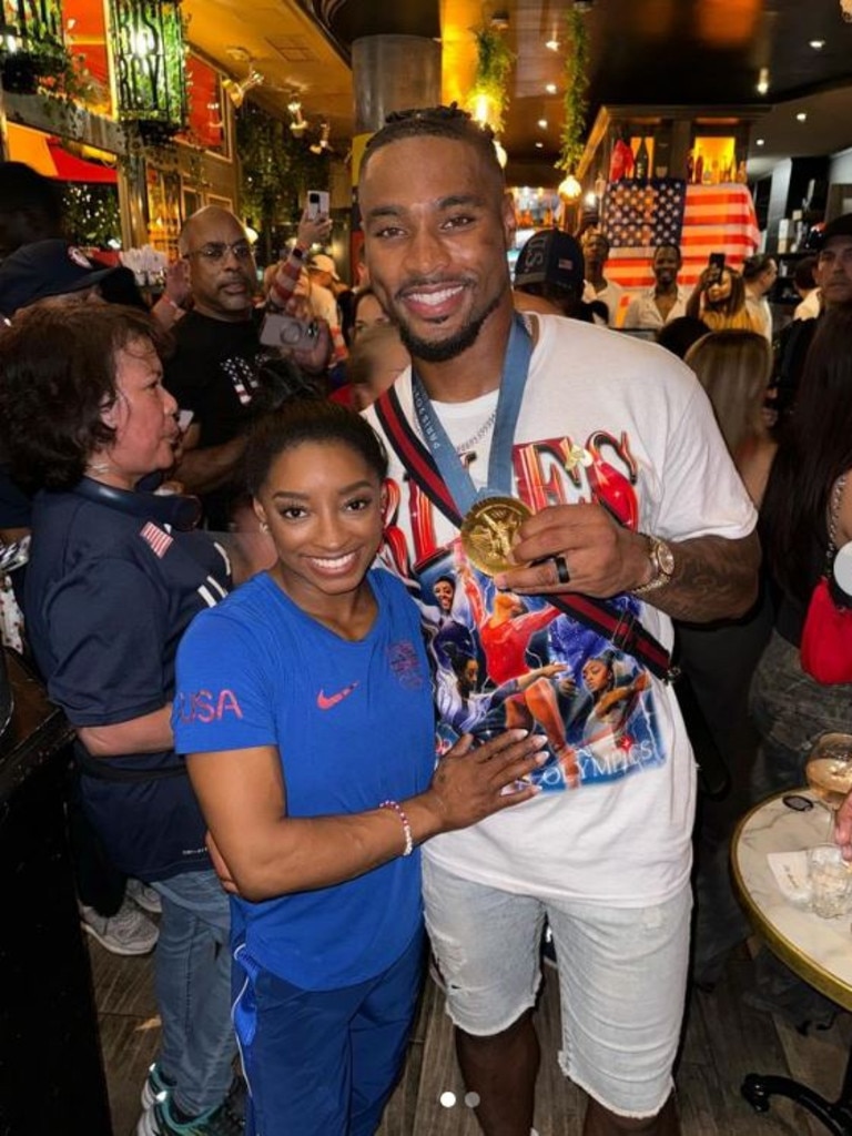 Biles with husband Jonathan Owens.