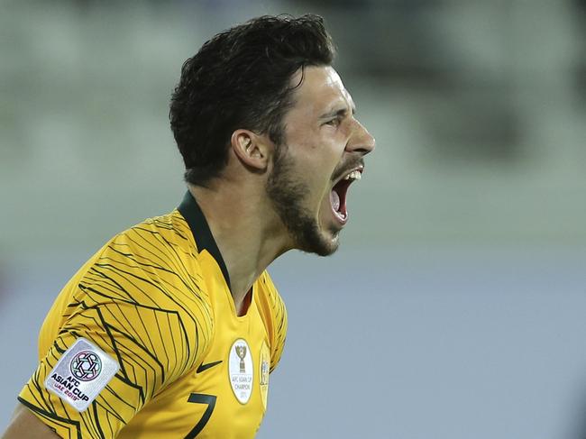 Australia's forward Mathew Leckie celebrates after scoring the winning penalty in a shootout at the end of the AFC Asian Cup round of 16 soccer match between Australia and Uzbekistan at the Khalifa bin Zayed Stadium in Al Ain, United Arab Emirates, Monday, Jan. 21, 2019. (AP Photo/Kamran Jebreili)