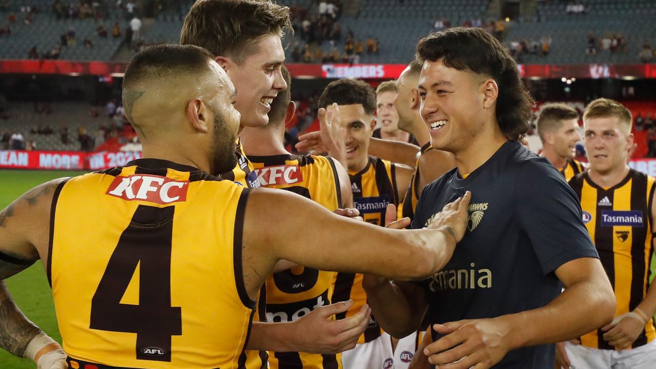 Connor Downie (right) was the sub for Hawthorn in his first game.