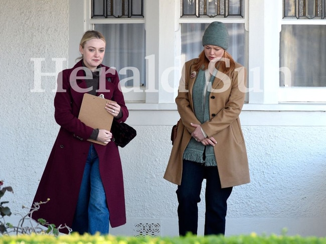 Fanning and Snook were seen knocking on doors during a scene for All Her Fault. Picture: Andrew Henshaw