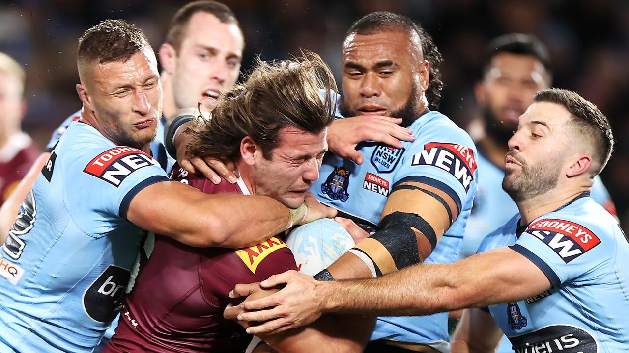 SYDNEY, AUSTRALIA – JUNE 08: Patrick Carrigan of the Maroons tis tackled during game one of the 2022 State of Origin series between the New South Wales Blues and the Queensland Maroons at Accor Stadium on June 08, 2022, in Sydney, Australia. (Photo by Mark Kolbe/Getty Images)