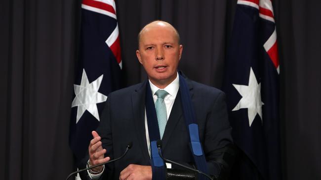 Home Affairs Minister Peter Dutton  holding a press conference at Parliament House in Canberra.