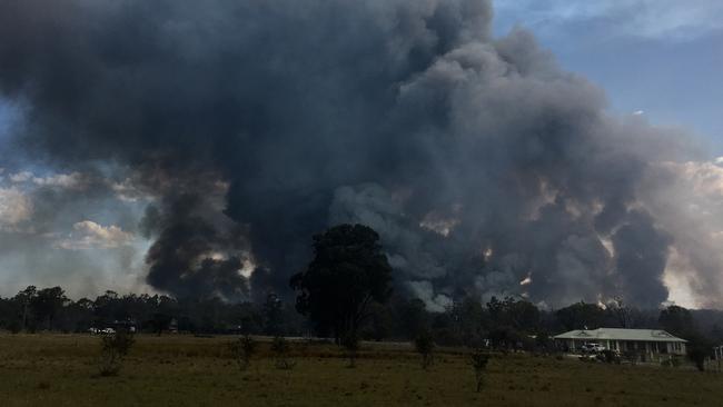 Firefighters have managed to push the blaze back from homes. Picture: Peter Lorimer