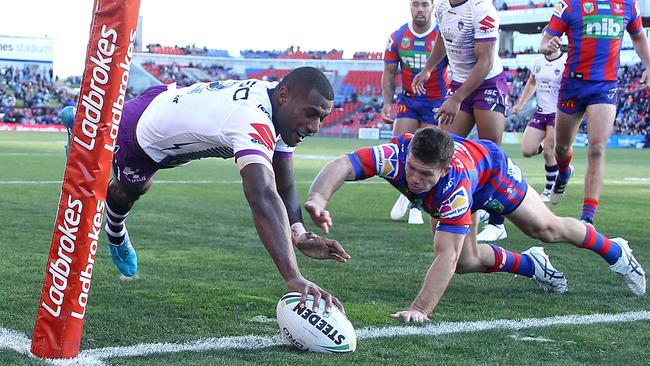 NEWCASTLE, AUSTRALIA - JUNE 17:  Suliasi Vunivalu of the Storm scores a try during the round 15 NRL match between the Newcastle Knights and the Melbourne Storm at McDonald Jones Stadium on June 17, 2018 in Newcastle, Australia.  (Photo by Tony Feder/Getty Images)