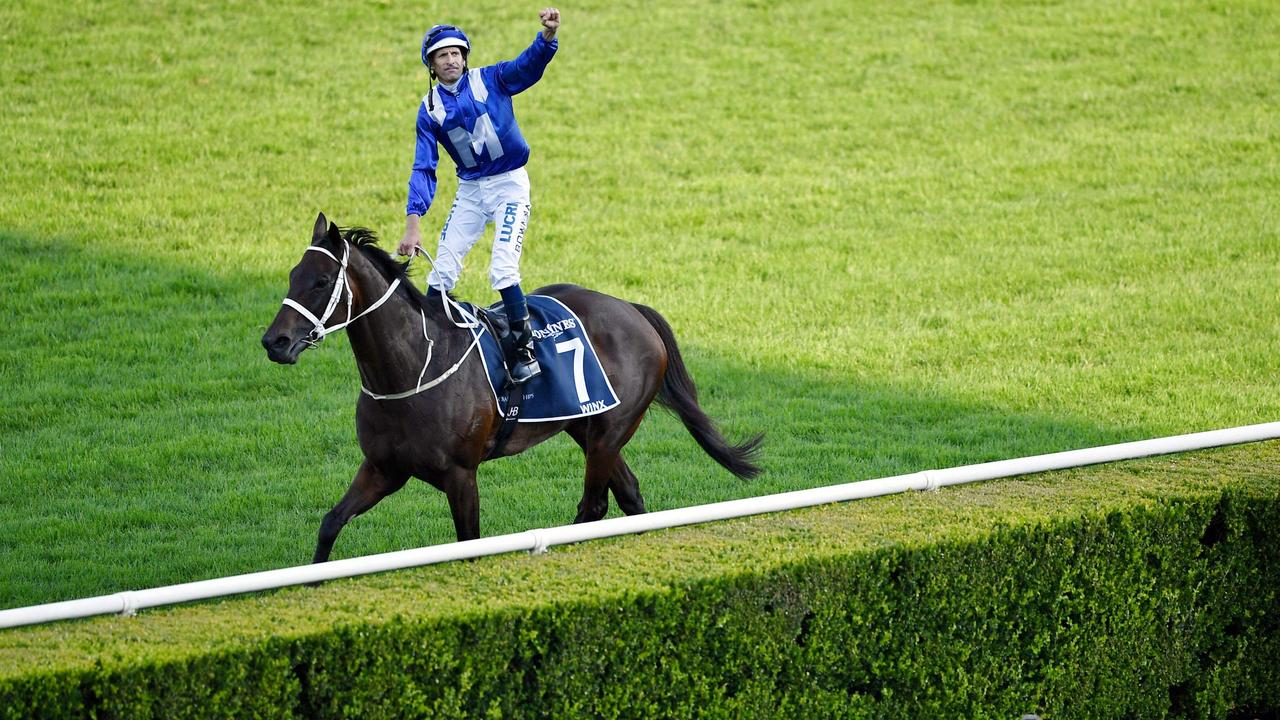 Jockey Hugh Bowman celebrates on the back of champion race horse Winx after her final race to victory in the Longines Queen Elizabeth Stakes during The Championships Race Day in Sydney on April 13, 2019. - Champion Australian mare Winx bid farewell on April 13 by winning her 33rd race in a row, ending her glittering career on a high with an amazing four-year unbeaten streak. (Photo by Wendell TEODORO / AFP) / -- IMAGE RESTRICTED TO EDITORIAL USE - STRICTLY NO COMMERCIAL USE --