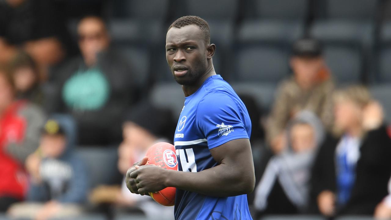 HOBART, AUSTRALIA - MARCH 09: Majak Daw of the North Melbourne Kangaroos warms up during the 2020 Marsh Community Series AFL match between the North Melbourne Kangaroos and the Sydney Swans at Kingston Town Oval on March 09, 2020 in Hobart, Australia. (Photo by Steve Bell/Getty Images)