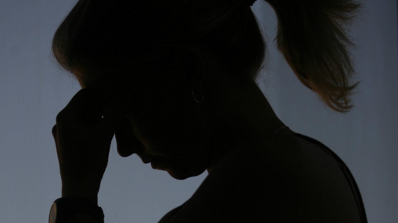 30/11/2007 FEATURES: Silhouette - generic of woman female crying, feeling sad and emotional.