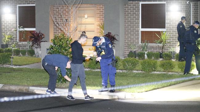 Police at the scene of the fatal stabbing in Riverstone. Picture: Steve Tyson