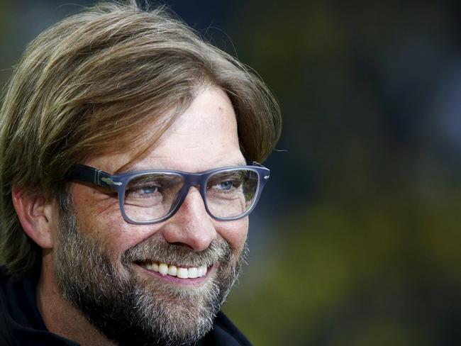 Juergen Klopp, then coach of Borussia Dortmund, smiles before their German Cup (DFB Pokal) final soccer match against Bayern Munich in Berlin, in this May 17, 2014 file picture. Liverpool have named former Borussia Dortmund coach Juergen Klopp as manager to replace the sacked Brendan Rodgers, the Premier League club said in a statement on October 8, 2015. The 48-year-old German has signed a deal to take over at Anfield and will be presented at a news conference on Friday. REUTERS/Michael Dalder/Files