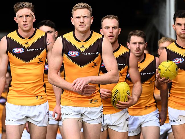 MELBOURNE, AUSTRALIA - APRIL 30: James Sicily of the Hawks leads his team out onto the field during the round seven AFL match between the Melbourne Demons and the Hawthorn Hawks at Melbourne Cricket Ground on April 30, 2022 in Melbourne, Australia. (Photo by Quinn Rooney/Getty Images)