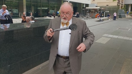 Nothing to wave a stick at: Conman Philip Fitzherbert leaves the County Court after pleading guilty to eight counts of obtaining financial advantage by deception.