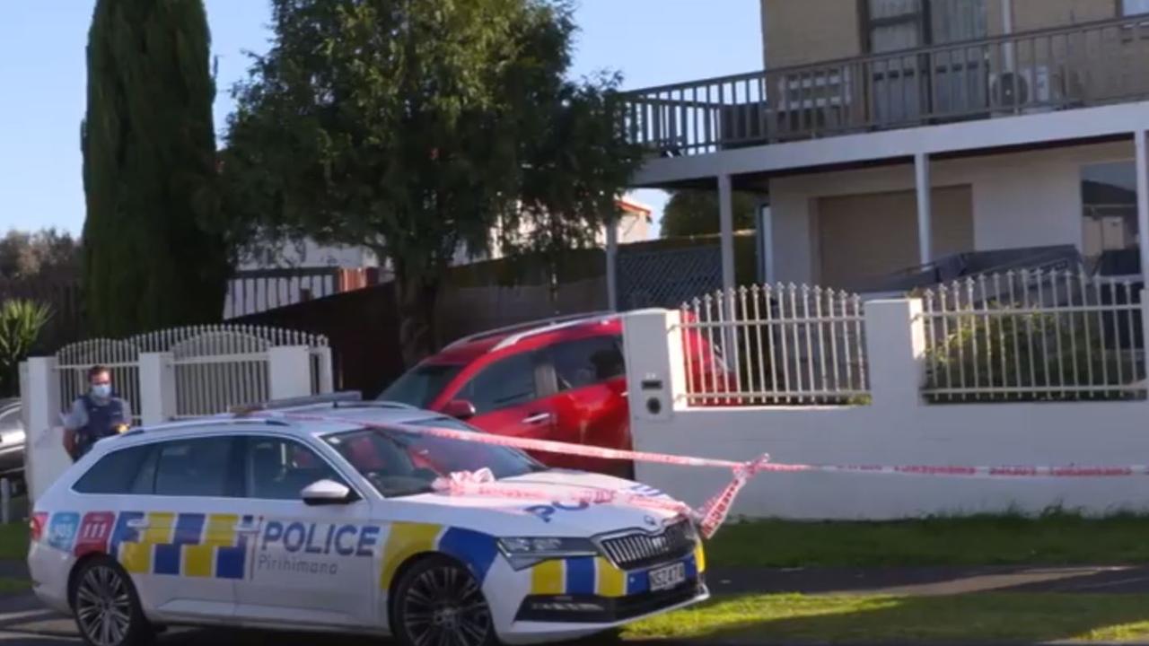 Police outside a home where human remains were found in several suitcases. Picture: NZ Herald