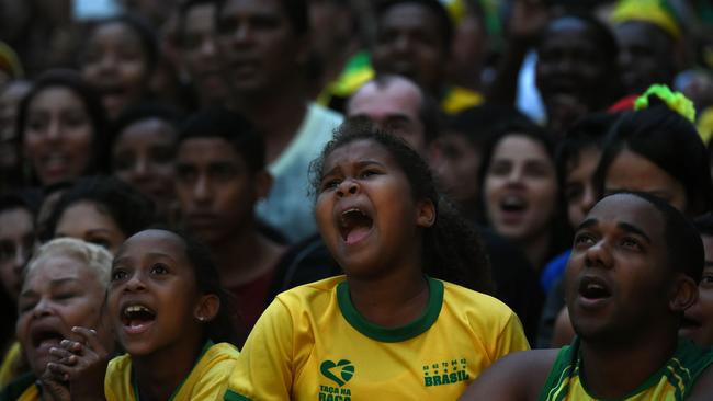 Brazil's fans react during a public viewing event at a street of Rio de Janeiro.