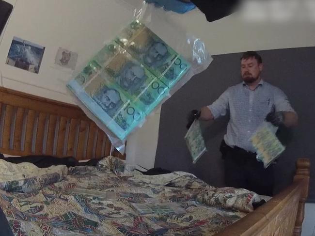 Detectives have charged six people following a raid for cash and drugs at a West Mackay home. Picture: Supplied