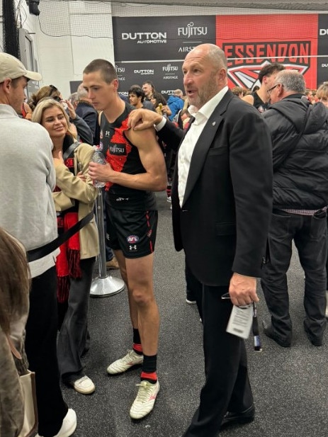 Craig Kelly with son Jake in Essendon's rooms after the Anzac Day draw. Photo: X.