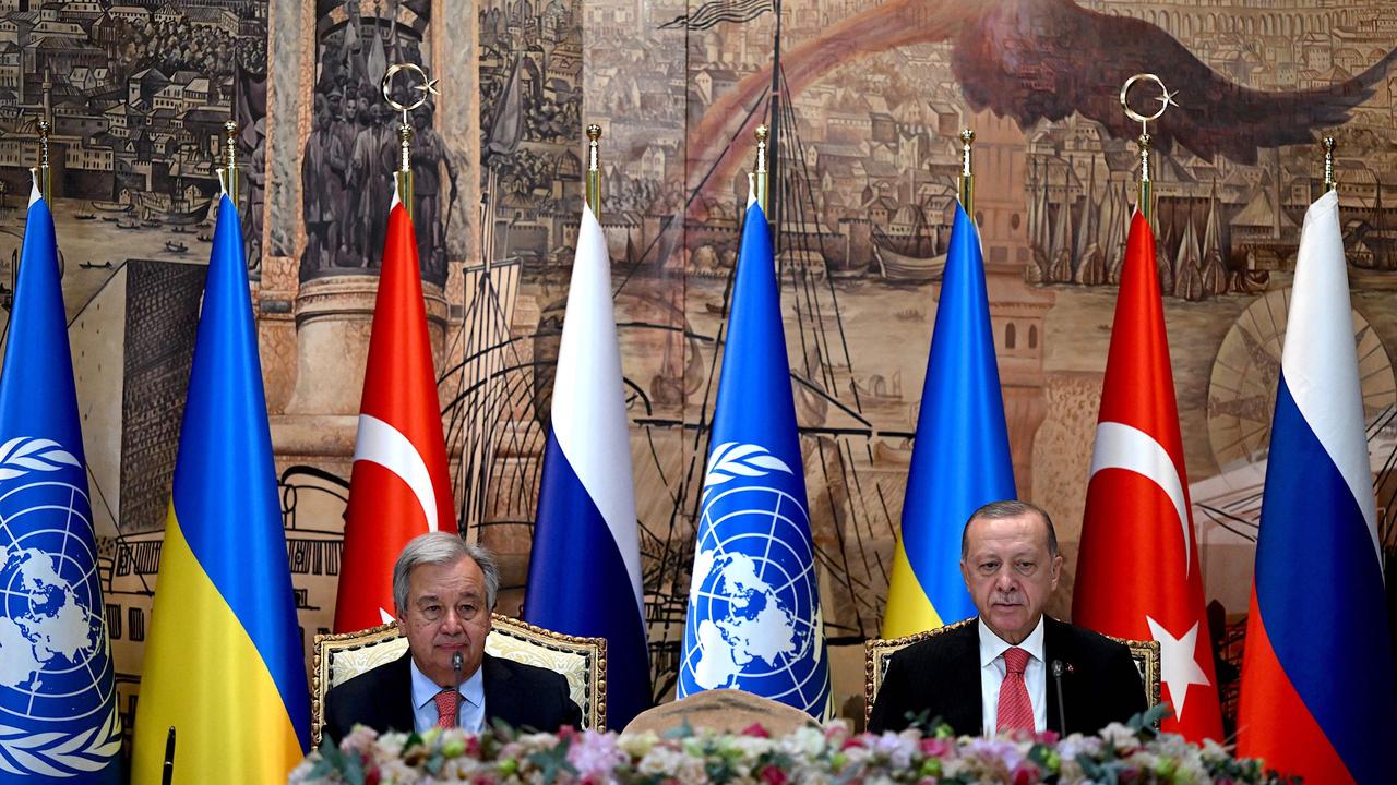United Nations Secretary-General Antonio Guterres and Turkish President Recep Tayyip Erdogan sit at the start of the signature ceremony. (Photo by OZAN KOSE / AFP)