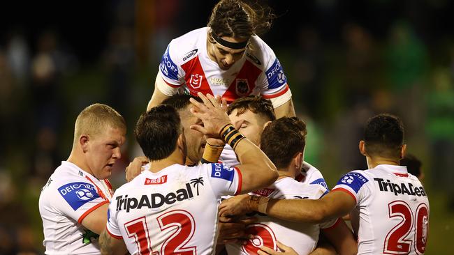 WOLLONGONG, AUSTRALIA - JUNE 19: Billy Burns of the Dragons celebrates scoring a try with team mates during the round 15 NRL match between the St George Illawarra Dragons and the Canberra Raiders at WIN Stadium, on June 19, 2021, in Wollongong, Australia. (Photo by Mark Nolan/Getty Images)