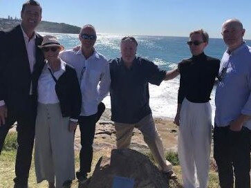 Northern Beaches Mayor Michael Regan (left) at the naming ceremony of a headland lookout at Curl Curl named in honour of former Warringah mayor Brian Green on Friday. Cr Regan was with Mr Green's wife Helen, sons Nicholas, Martin and Timothy and their daughter, Sarah. Picture: Northern Beaches Council