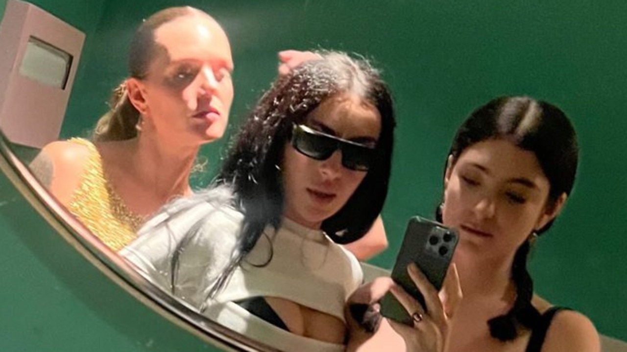 Meeting in the ladies room: Tove Lo, Charli and Lorde pose for a mirror selfie.