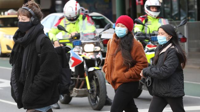 These Melburnians are wearing masks and doing the right thing — but not all young people are following the rules. Picture: NCA NewsWire/David Crosling