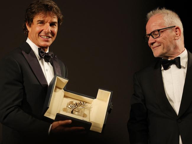 Tom Cruise receives a Palme d'Or from Cannes Film Festival director Thierry Fremaux ahead of the screening of the film Top Gun: Maverick. Picture: AFP