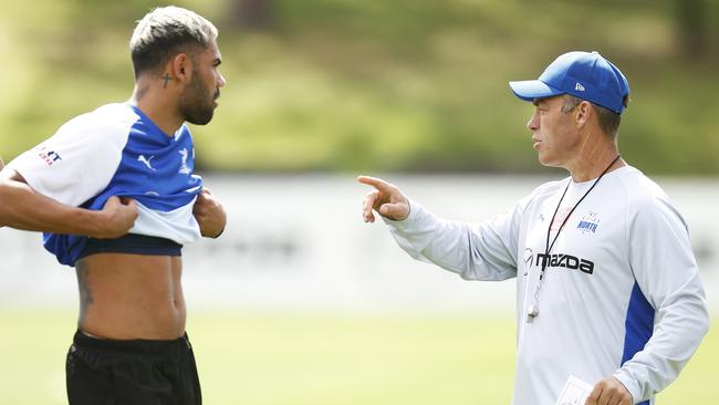 MELBOURNE, AUSTRALIA - NOVEMBER 21: Kangaroos head coach Alastair Clarkson (R) instructs Tarryn Thomas of the Kangaroos and Paul Curtis of the Kangaroos (L) during a North Melbourne Kangaroos training session at Arden Street Oval on November 21, 2022 in Melbourne, Australia. (Photo by Daniel Pockett/Getty Images)