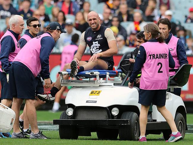 Chris Judd exits the MCG as a player for the last time, stretchered off after suffering a knee injury.