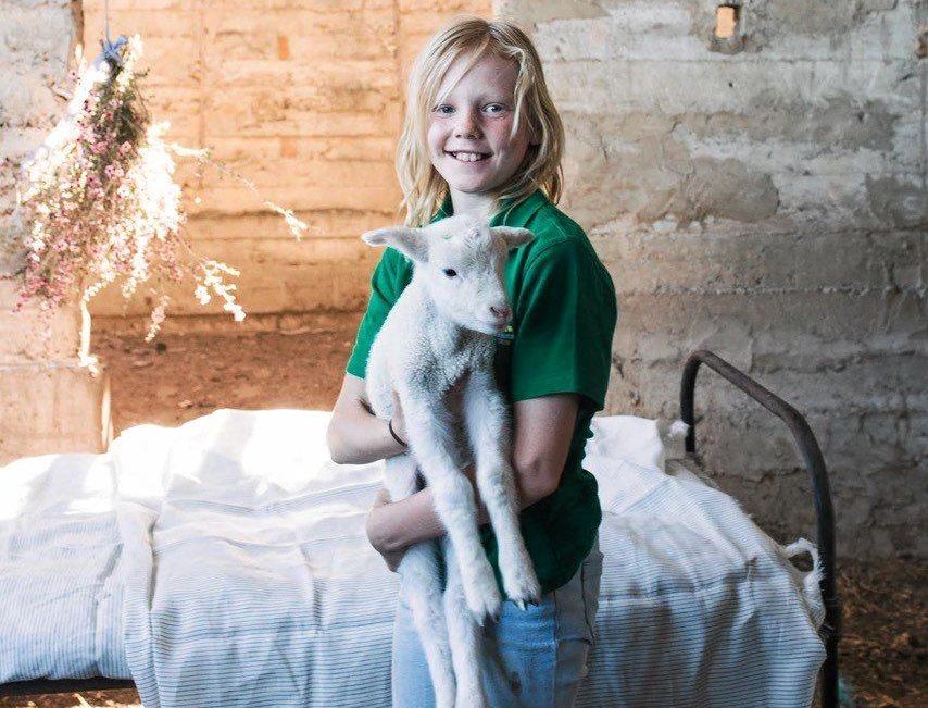 MATES: Georgi worked with Al the lamb for the photo shoot. Picture: Annabelle Hickson