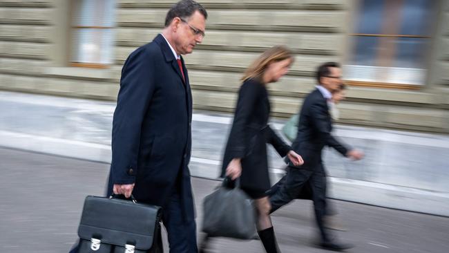 Chairman of the Swiss National Bank (SNB) Thomas Jordan (L) with his team leaves the Swiss Federal Department of Finance after talks on Credit Suisse bank crisis in Bern on March 19, 2023 - UBS was up against the clock on March 19, 2023 in talks to finalise a mammoth takeover of its troubled rival Swiss bank Credit Suisse and reassure investors before the markets reopen. Switzerland's biggest bank UBS is being urged by the authorities to get a deal over the line in a bid to avoid a wave of contagious panic on the markets Monday, according to several media reports. (Photo by Fabrice COFFRINI / AFP)