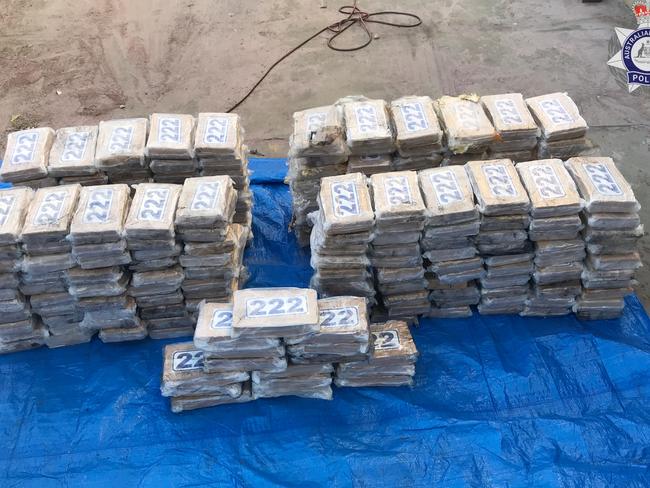 The AFP has charged two men with importing a commercial quantity of cocaine as part of an investigation into 247kg of cocaine seized from a yacht moored in Townsville.